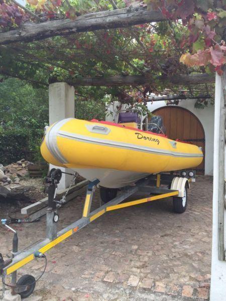 Semi-ridged boat with trailer