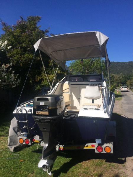 Sleep-o-Ret Cabin Boat with 100 hp V4 Suzuki trim and tilt