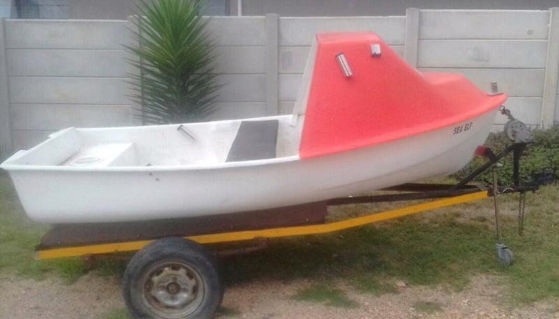 Small cabin boat on trailer with 2.5 Mariner