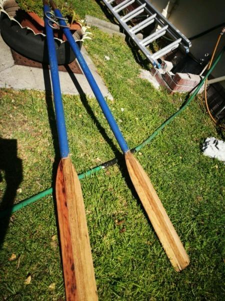 Wooden rowing oars with rowlocks