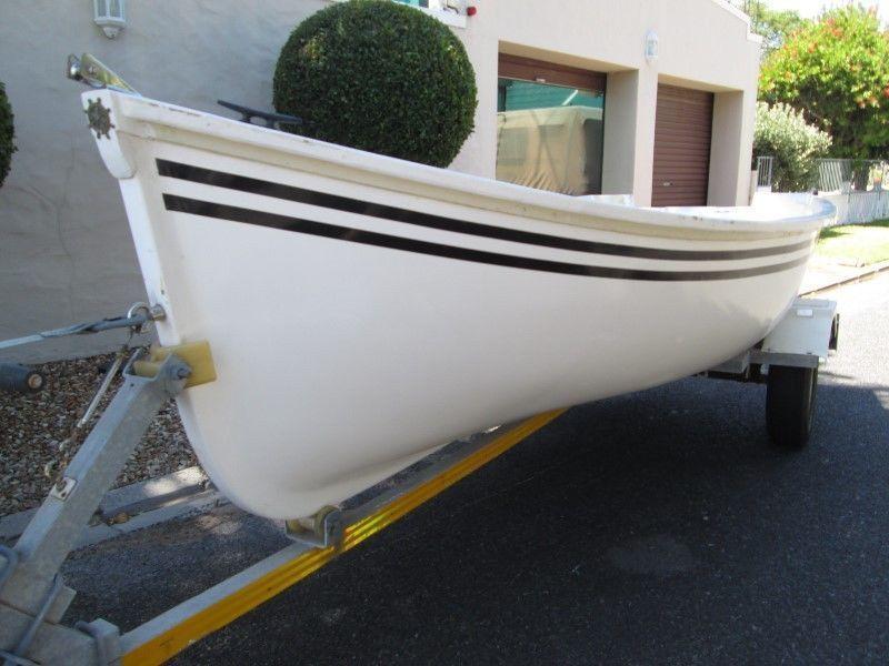 Fibreglass sea going boat on galvanised trailer