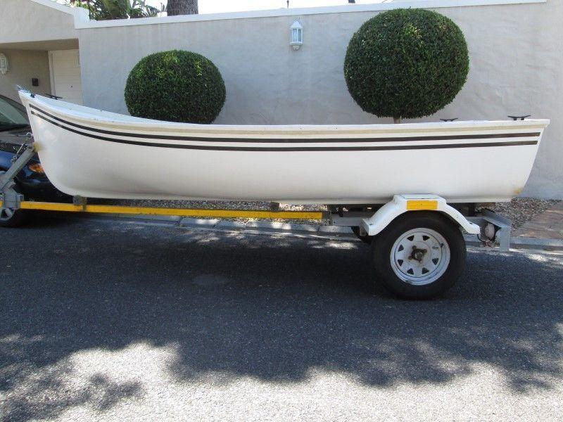 Fibreglass sea going boat on galvanised trailer