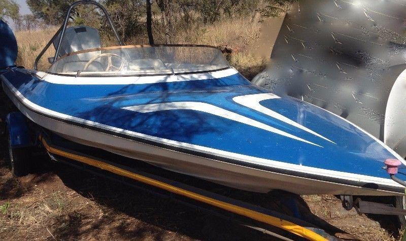 Ski Boat and Trailer with 85HP Evirude