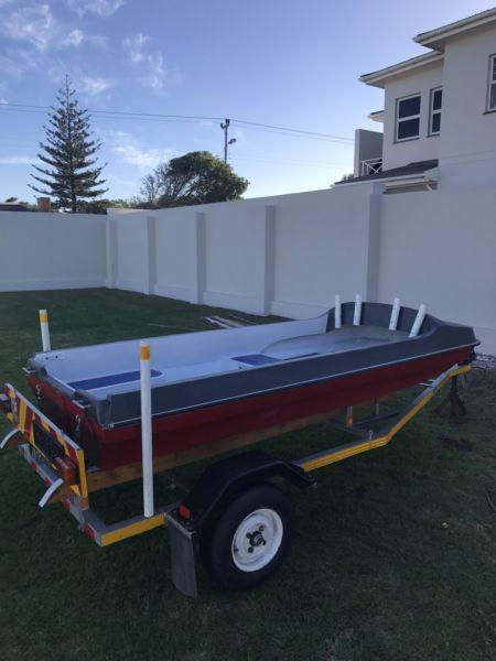 Neat river boat and trailer