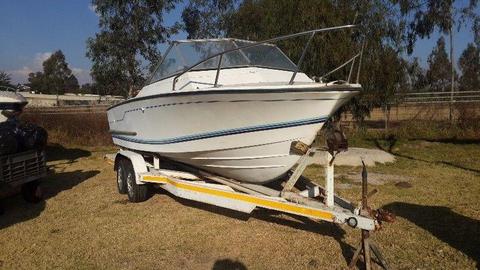 21ft Deep V boat on double axle trailer