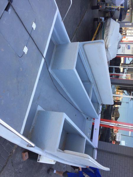 Open boat, benched to carry people - no trailer