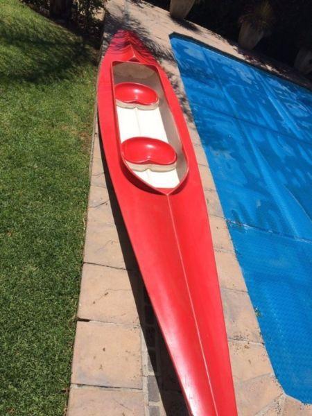 Two seater fiberglass canoe