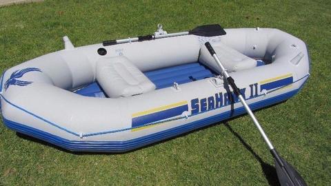 Inflatable boat with motor, life jackets and paddle ski