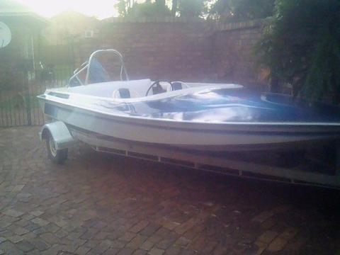 Raven speed boat with trailer and 70hp. Evenrude outboard
