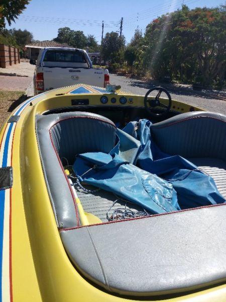 Raven with 140 Suzuki on trailer