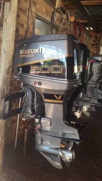 200 HP Outboard for sale good as new also a boat for sale