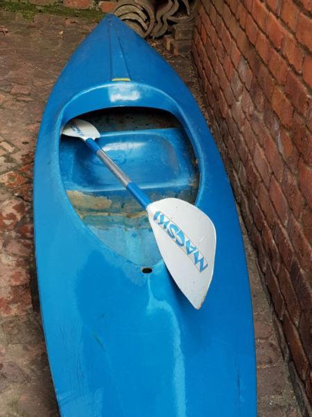 One man canoe with paddle. Good condition