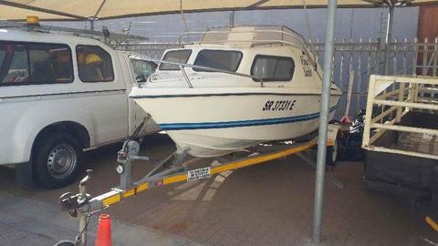 Cabin ski boat and trailer for sale
