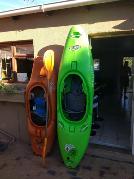 2 Fluid kayaks and a paddle