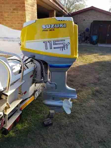 Suzuki 115 Outboard Engine with steering, trim and tilt and controlls
