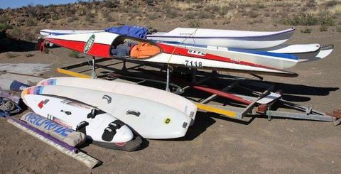 Canoe’s, sea kayaks and windsurfers with trailer for sale