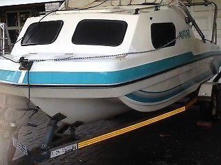 Crusader cabin boat , moter , galv. trailer and extras