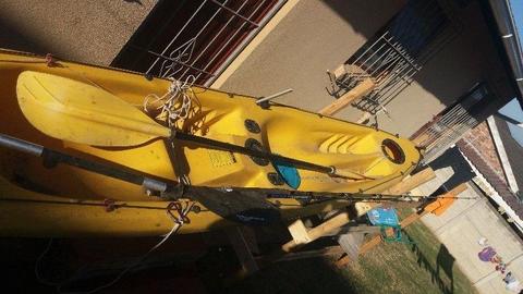 2 man solid kayak deep sea and river 4 rod holders 3 hatches to store stuff 2 ores 2 decent rods