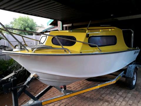Cabin boat on trailer with 65hp suzuki