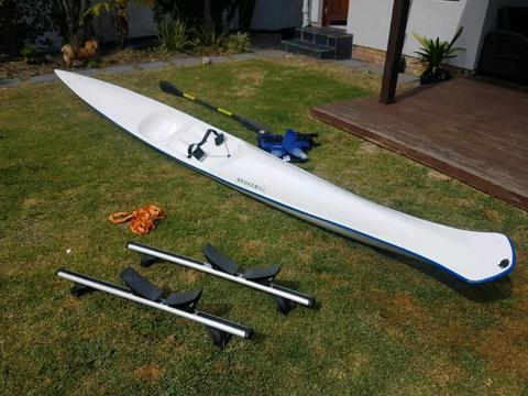Surfski with carbon paddle and life jacket