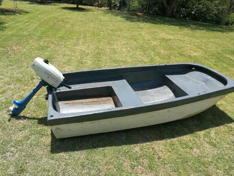 2 hp suzuki outboard and small boat