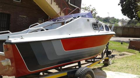 For sale 18ft bouysen cabin boat with trailer and 75 hp mercury engine