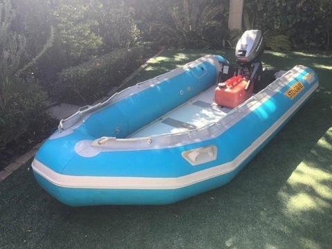 Stingray Inflatable boat (fold up) with 15hp Mariner