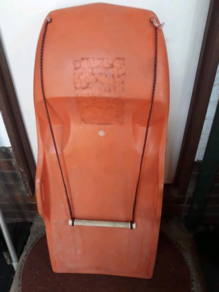 Old type moulded PVC knee board for towing with powerboat. 